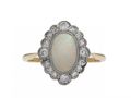 Edwardian opal and diamond oval cluster ring in platinum on gold