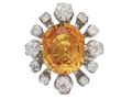 Modern 6.52ct fancy yellowish orange sapphire and old cut diamond cluster ring