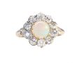 A Victorian cluster ring featuring a cabochon opal