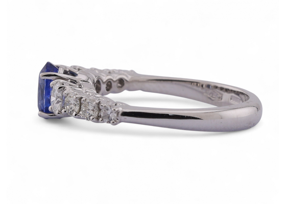 Modern Italian 18kt white gold ring with 0.90ct oval sapphire and 0.64ct diamond shoulders