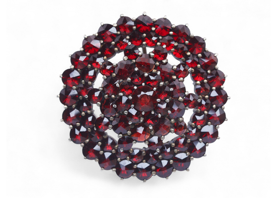Antique silver gilt brooch set with rose-cut garnets in a domed circular cluster