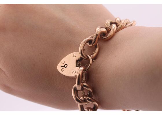 Vintage curb link rose gold bracelet with heart shape locket