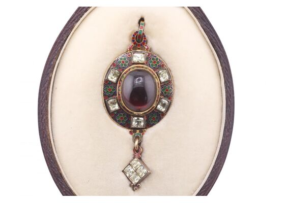 RENAISSANCE REVIVAL GARNET, CHRYSOBERYL AND ENAMEL HOLBEINESQUE PENDANT, CIRCA 1870.