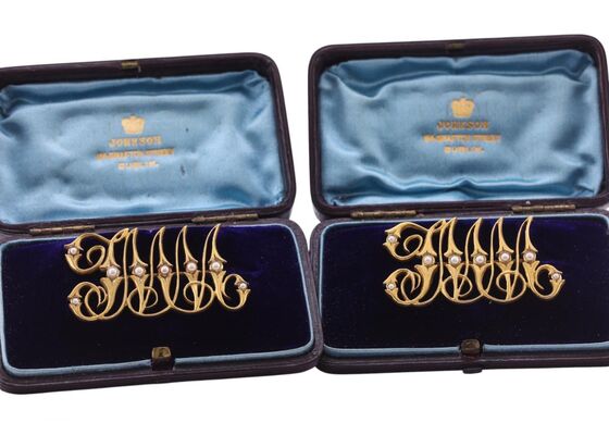 LATE VICTORIAN GOLD AND SEED-PEARL MONOGRAM BROOCHES, CIRCA 1890