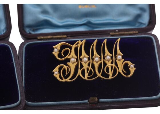LATE VICTORIAN GOLD AND SEED-PEARL MONOGRAM BROOCHES, CIRCA 1890