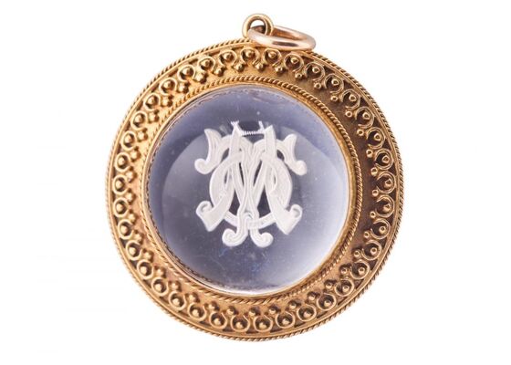 VICTORIAN ESSEX ROCK CRYSTAL GOLD PENDANT ENCLOSING INITIALS T.O.M, CIRCA 1870
