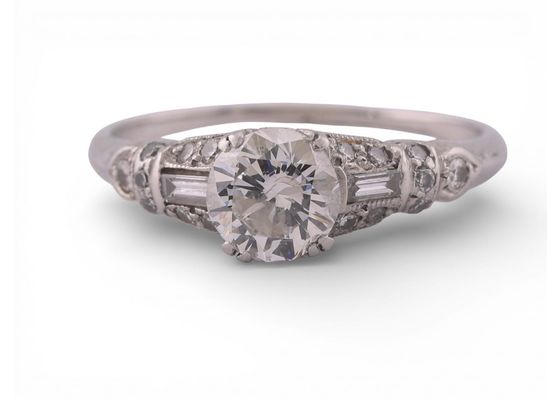 Art Deco Platinum Diamond Solitaire Ring with Baguette and Round AccentsArt Deco Platinum Diamond Solitaire Ring with Baguette and Round Accents