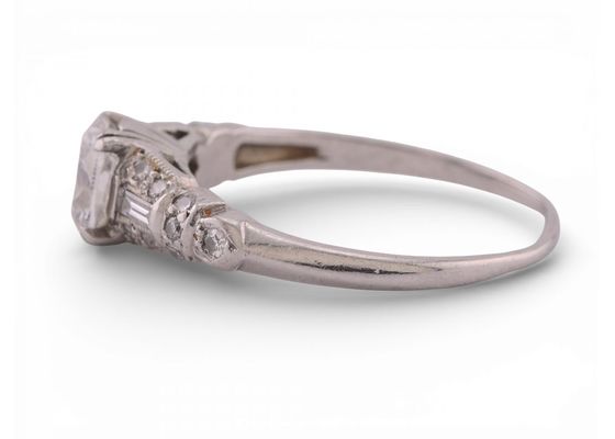 Art Deco Platinum Diamond Solitaire Ring with Baguette and Round Accents