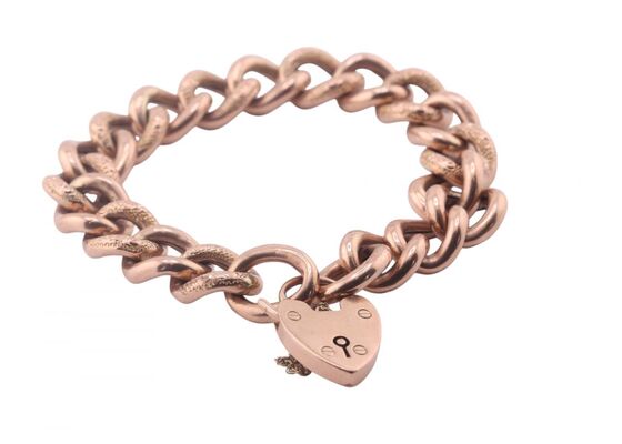 Vintage curb link rose gold bracelet with heart shape locket